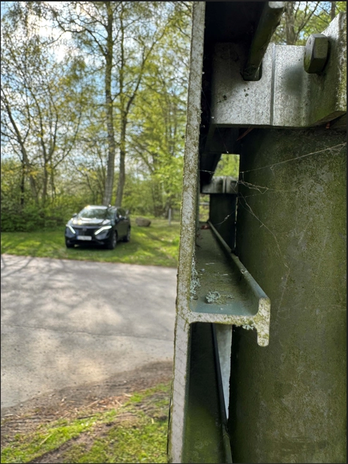 Geocacher searching at an unexpected location during the road trip